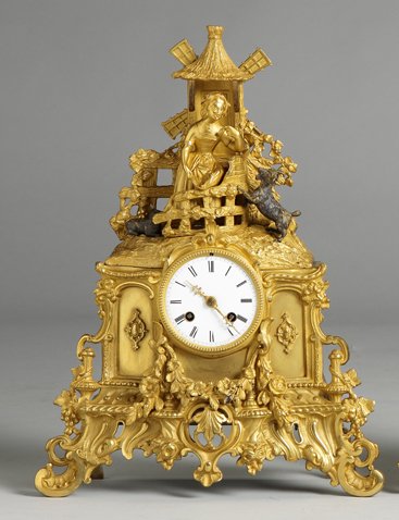 French Gilt Bronze Shelf Clock: French Gilt Bronze Shelf Clock. 19th cent. Porcelain dial, spider hairline. 8 day time and strike movement. Ht. 16". A Private Collection.