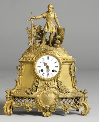 French Gilt Bronze Shelf Clock: French Gilt Bronze Shelf Clock . Early 19th cent. w/Christopher Columbus. Porcelain dial, small flake near winding arbor. Silk thread suspension movement. Ht. 15". A Private Collection.