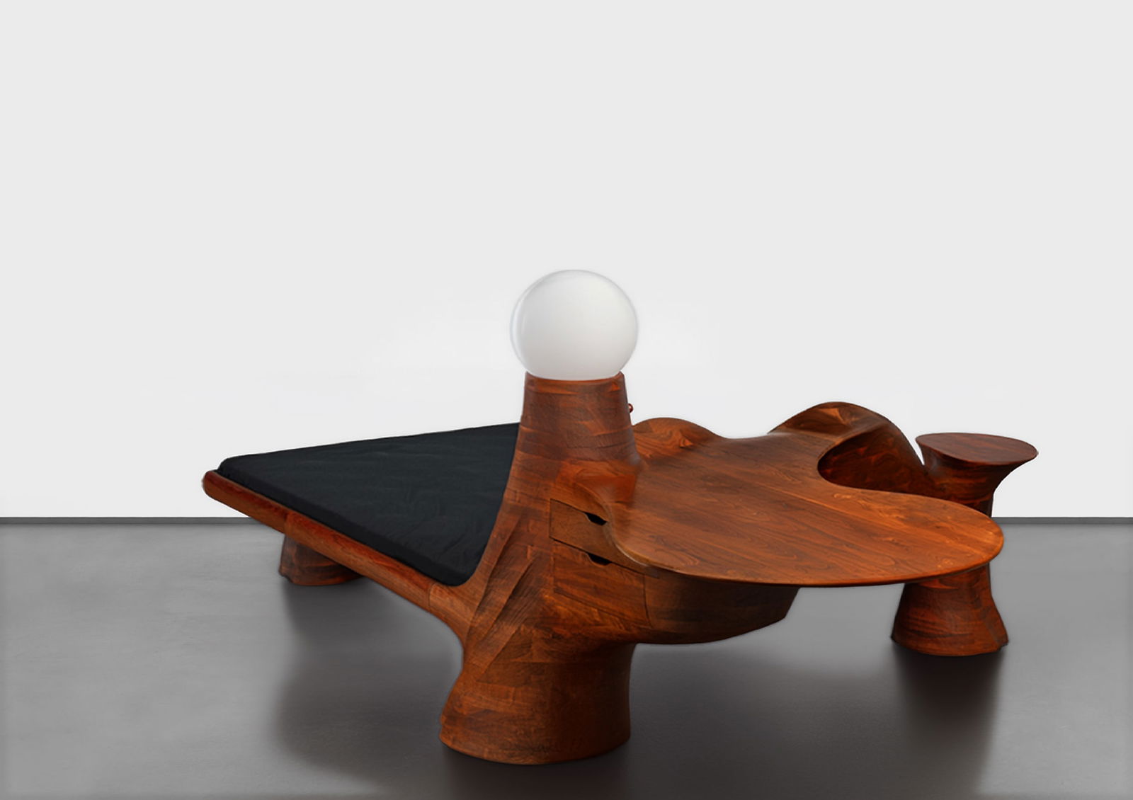 Wendell Castle (American, 1932-2018) Environment: Wendell Castle (American, 1932-2018) Environment 1972. Walnut. Signed 'WC 72'. Studio inventory #233. Bed incorporates a desk lamp, chest of drawers, and a night table. Fits a queen size mattress