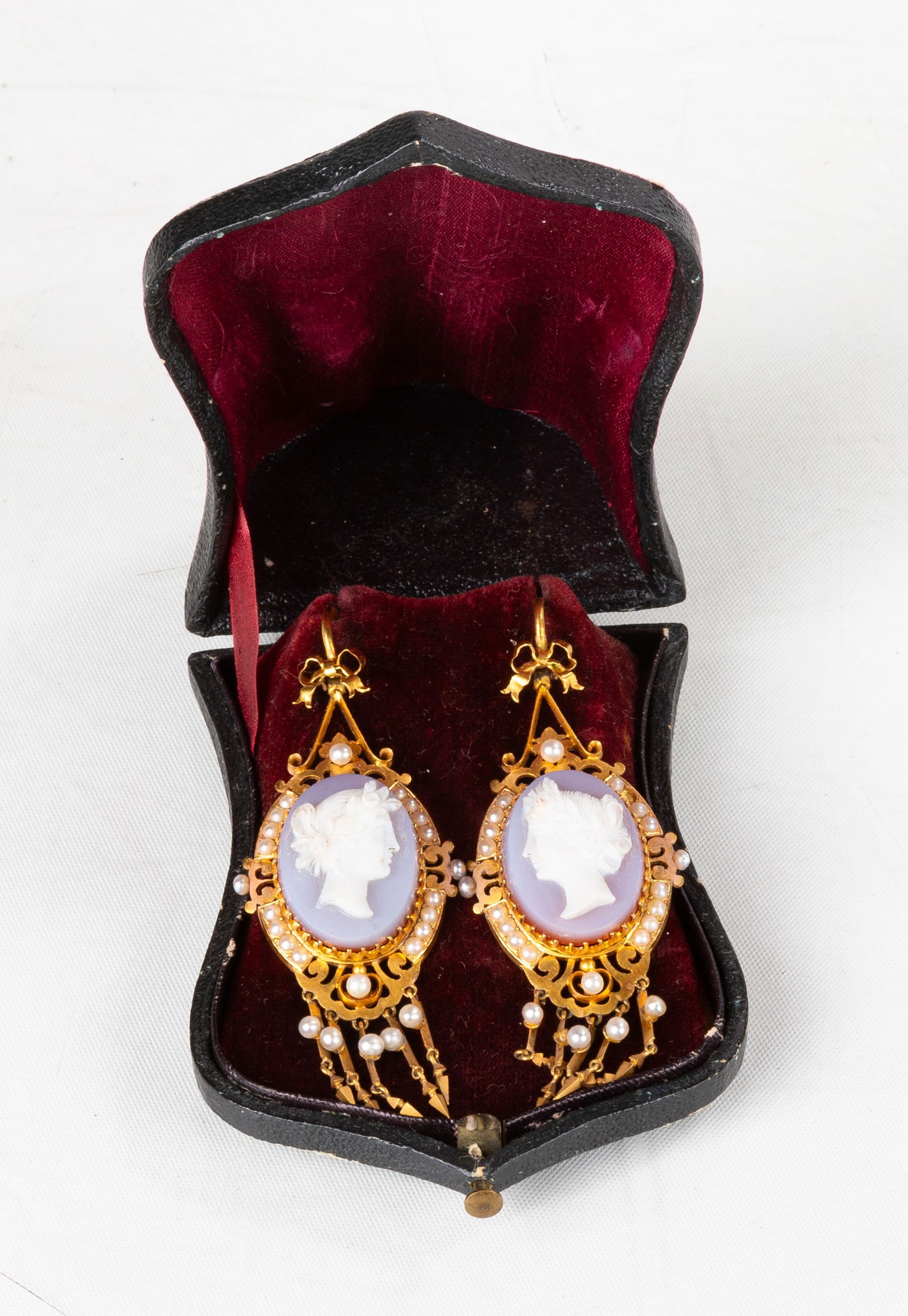 19th Century 14K Gold Filigree & French Agate Cameo Earrings with Seed Pearls: 19th Century 14K Gold Filigree & French Agate Cameo Earrings with Seed Pearls Carved agate classical women cameos with purple backing and natural seed pearls. Total weight: 16.1 grams. Max L. 2 3/4
