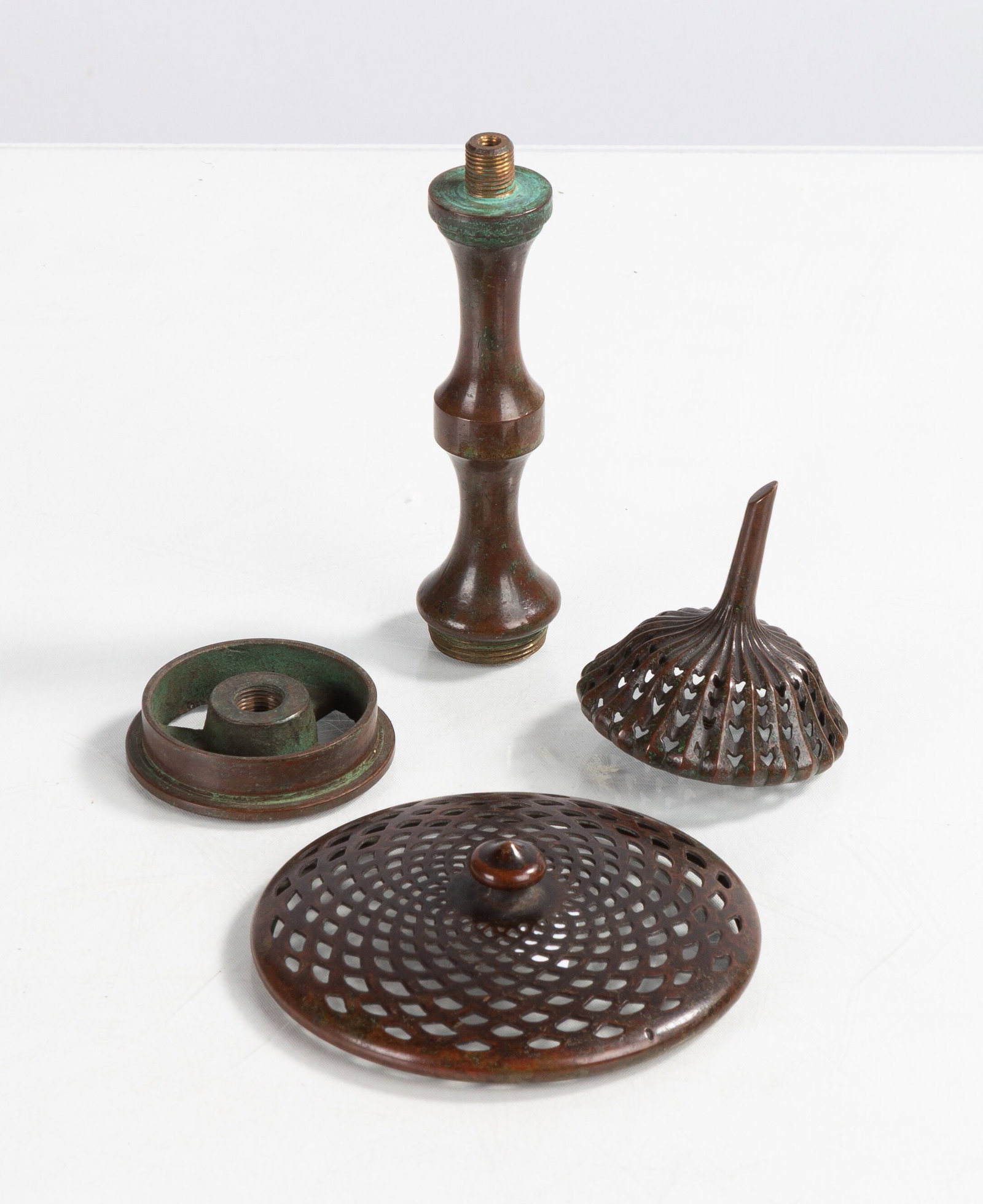 Tiffany Studios Lamp Heater Caps, Riser, & Wheel: Tiffany Studios Lamp Heater Caps, Riser, & Wheel Circa 1910. Patinaed bronze. Max L. 4 5/8 in. Shipping Note: We provide our own in-house shipping service; separate from LiveAuctioneers. We can also h