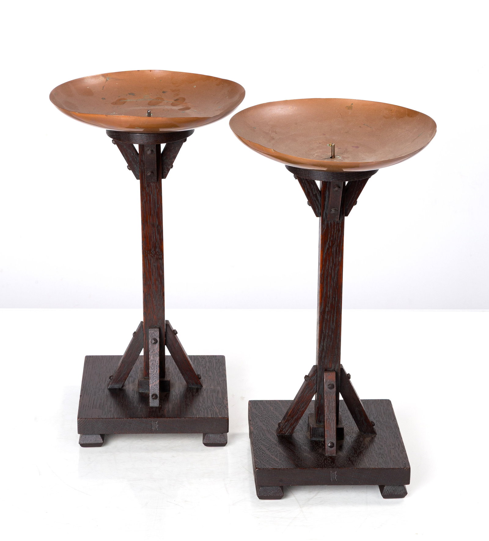 Charles Rohlfs, A Pair of 'Beacon Hill' Buttressed Oak & Copper Candlesticks, Model No. 4: Charles Rohlfs, A Pair of 'Beacon Hill' Buttressed Oak & Copper Candlesticks, Model No. 4 Buffalo, New York, circa 1902. Quarter-sawn oak and copper. Each with a flaring buttressed stem rising from a 