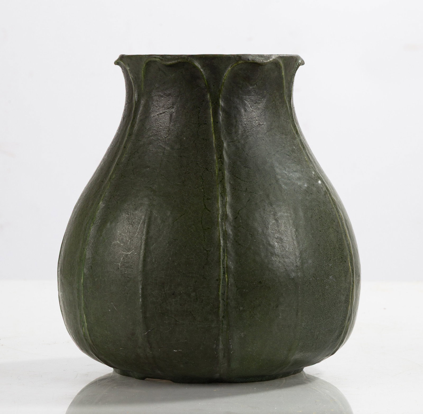 Grueby Pottery Tooled-Leaf Matte Green Glazed Earthenware Vase: Grueby Pottery Tooled-Leaf Matte Green Glazed Earthenware Vase Boston, Massachusetts, circa 1905. Glazed earthenware. Impressed circular Grueby Pottery mark to underside. Ht. 8 in. The collection of D