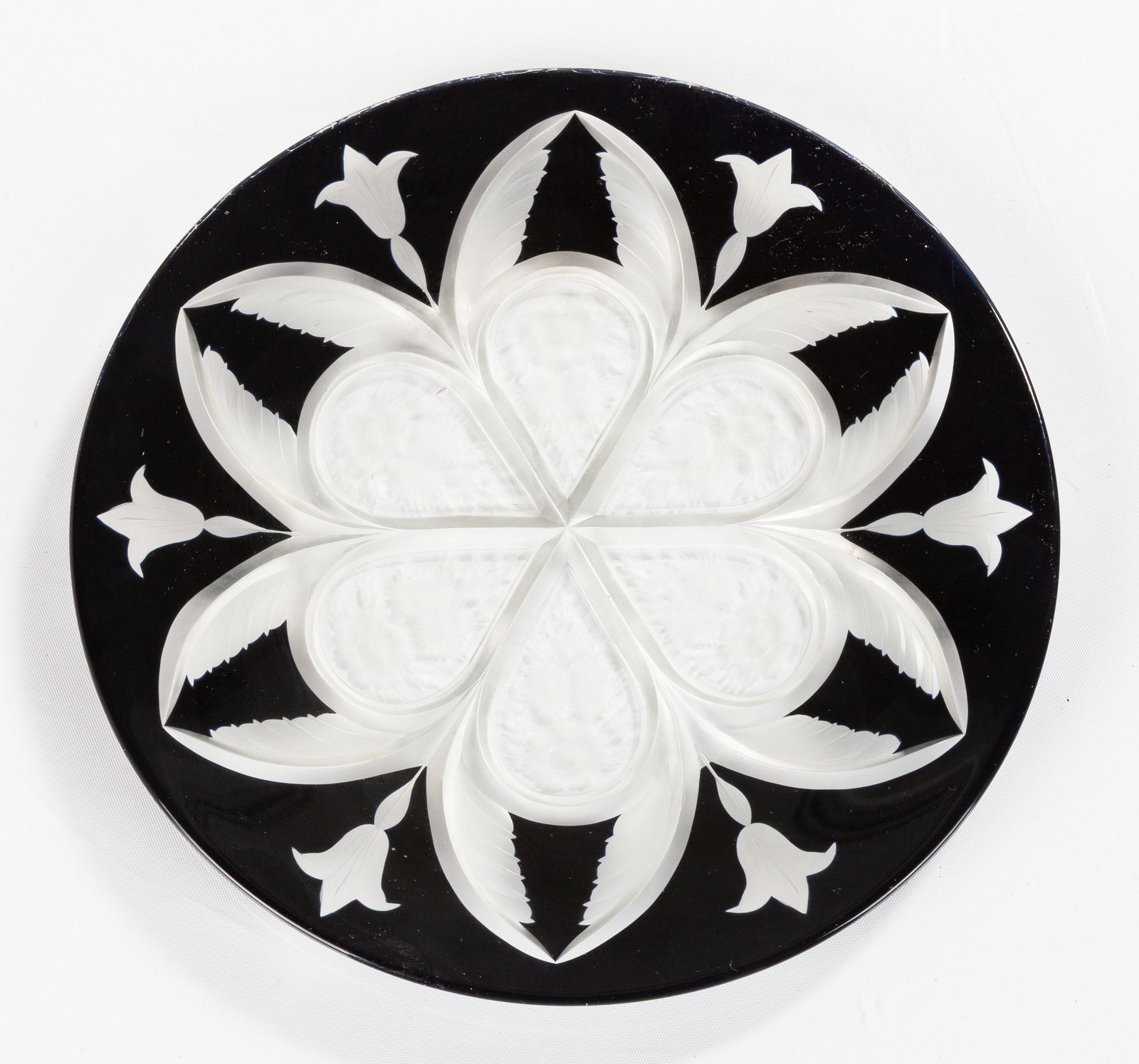 Rare Steuben Cut-Back Crystal Plate: Rare Steuben Cut-Back Crystal Plate Circa 1920s. Mirror black cut-to-clear crystal, the cut ground left matte and satin against the polished black. Dia. 8 1/4 in. The collection of Ruth deLorraine,