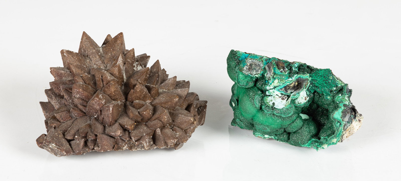Calcite Dogtooth & Malachite Chrysocolla Stones: Calcite Dogtooth & Malachite Chrysocolla Stones Chihuahua, Mexico, and Congo. Two natural mineral specimens, unmounted: a dogtooth-form calcite crystal cluster, and a botryoidal malachite with chrysoc