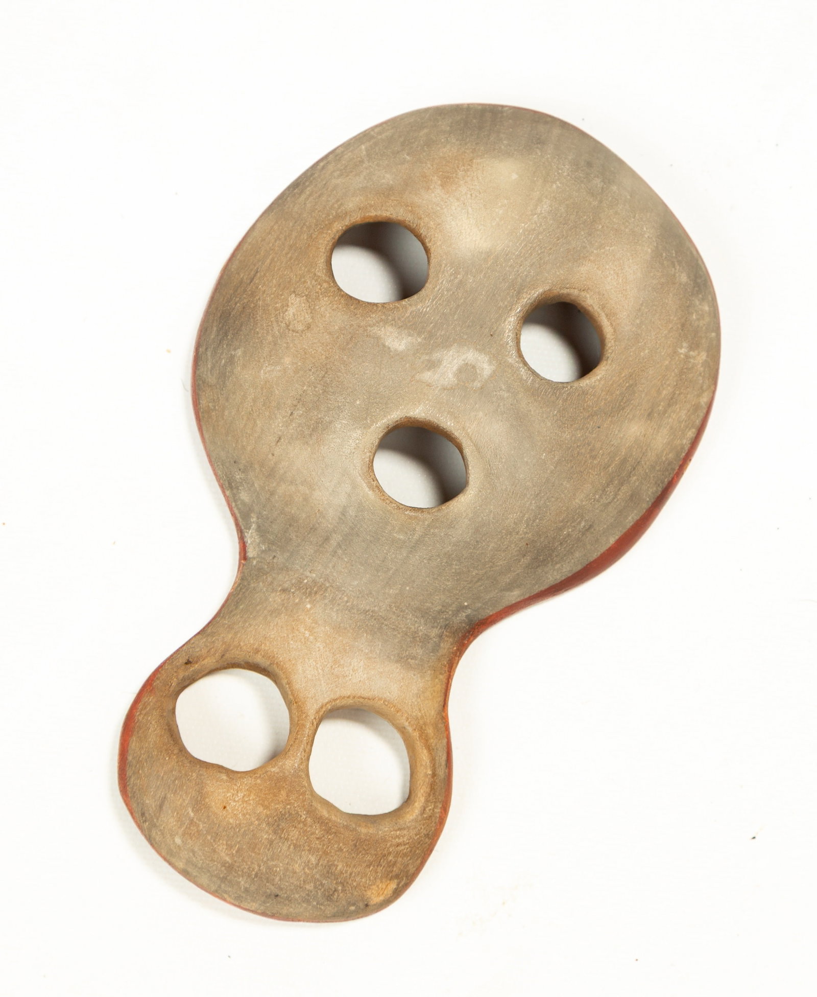 Yup'ik Carved Wood Finger Mask: Yup'ik Carved Wood Finger Mask Alaska, late 19th to early 20th century. Round face with pierced eyes and mouth above two finger holes, traces of red pigment. Old collection labels to back. L. 7 1/2 in