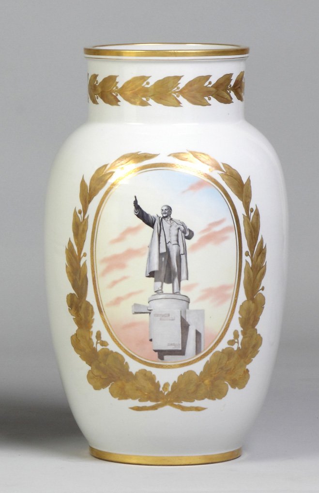 Soviet Porcelain Vase: Soviet Porcelain Vase. White & gold. Depicting Lenin statue on platform w/gilt laurel wreath. Ht.19".