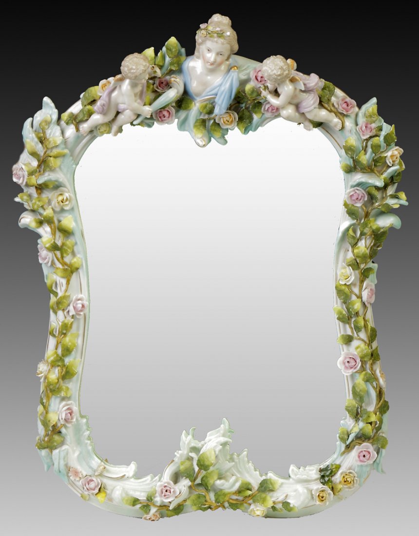 German Hand Painted Porcelain Mirror: German Hand Painted Porcelain Mirror. Applied flowers & cherubs. Ht. 20" W 15"