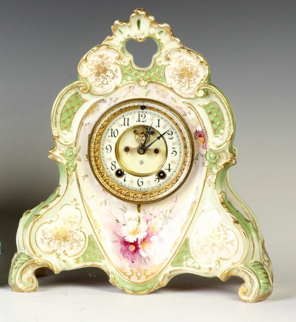 Ansonia Royal Bonn Shelf Clock: Ansonia Royal Bonn Shelf Clock. Porcelain dial, outside escapement. 8 day time & strike brass movement. Excellent. Ht. 14"