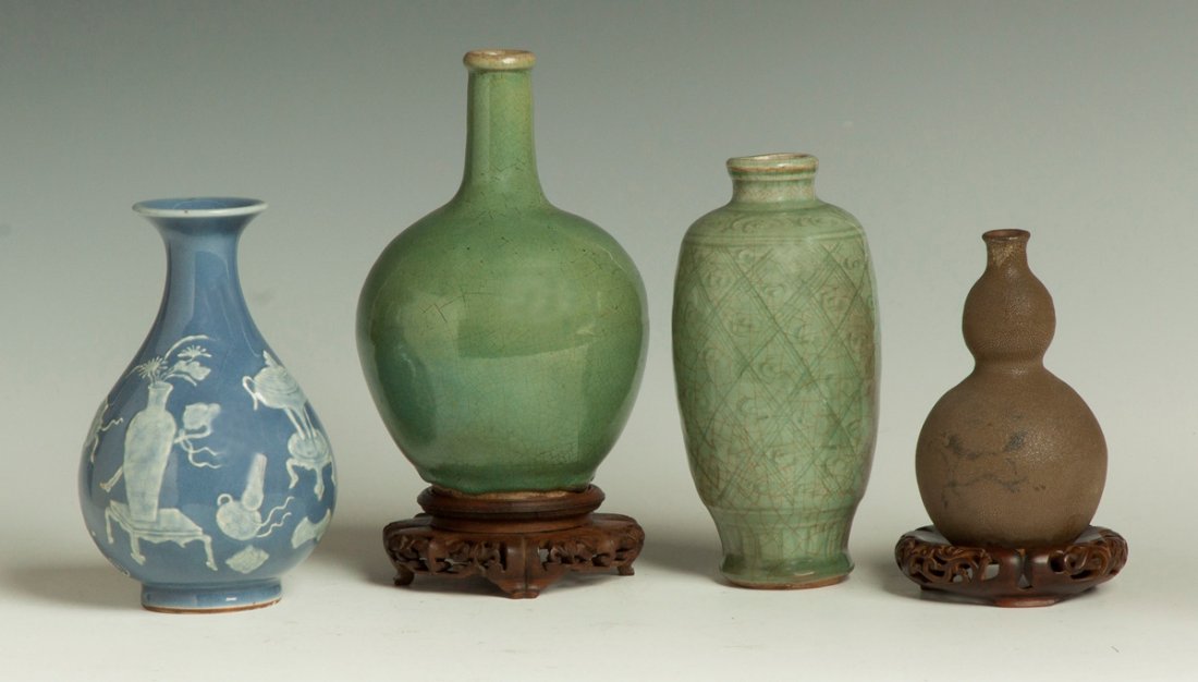 Four Chinese Vases: Four Chinese Vases.Blue Porcelain Vase, Sgn., Raised decoration, very good, Ht. 7 1/2" Dia. 4 1/2". Green Glazed Ovid From Bottle, crackle glaze, very good, Ht. 8" Dia. 5". Celadon Vase, incised, deco