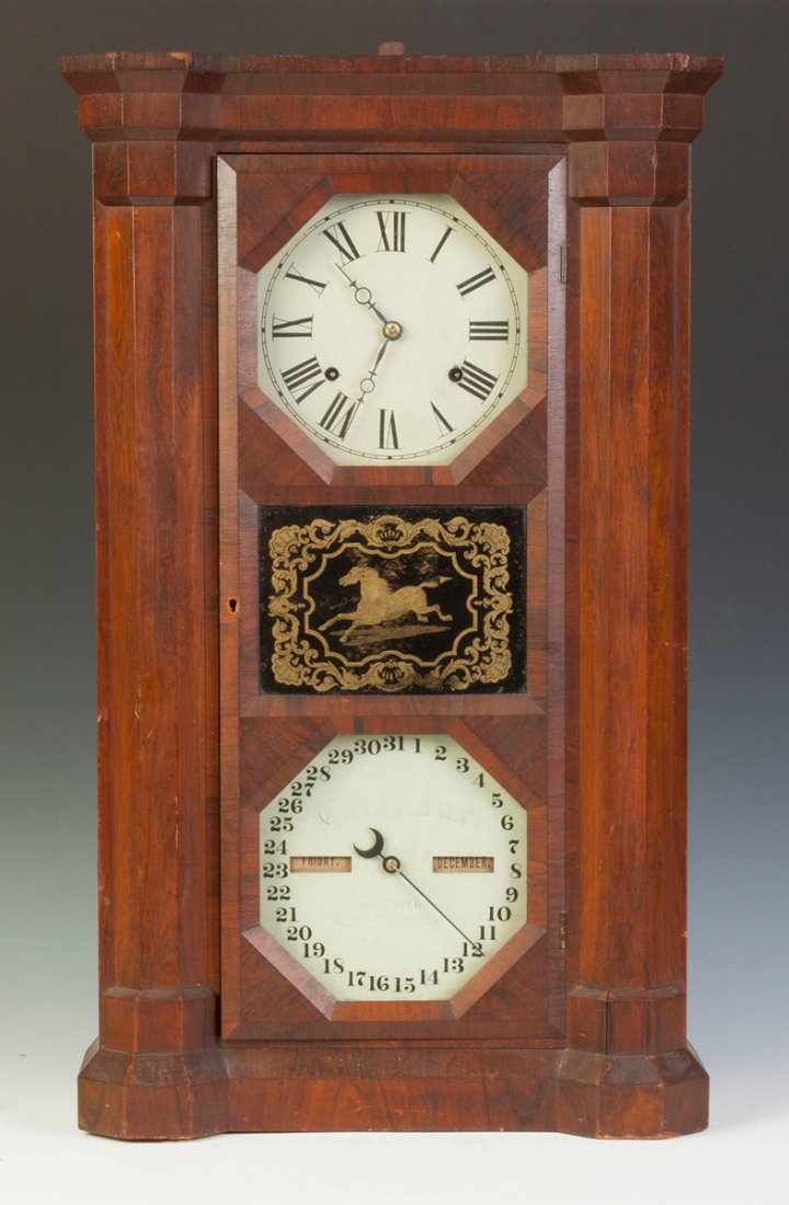 Seth Thomas Double Dial Calendar Clock: Seth Thomas Double Dial Calendar Clock. Mahogany case, original finish. Original painted dials. Original reverse painted glass with running horse. Weight driven calendar movement. Good labels. Ht. 30
