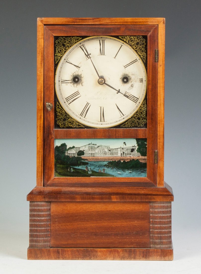 J. C. Brown Ripple Front Cottage Clock: J. C. Brown Ripple Front Cottage Clock. Mahogany case, old refinish. Original signed & painted metal dial. Original painted glasses, "Buckingham Palace". 30 hour time & strike spring driven brass move