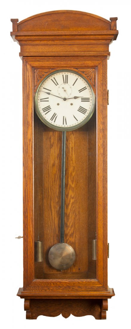 Sessions Clock Co., Forestville, CT, Regulator #6: Sessions Clock Co., Forestville, CT, Regulator #6. C. 1912. Oak case, original finish. Original painted paper dial. 8 day time only weight driven brass movement with dead beat escapement & second bit 