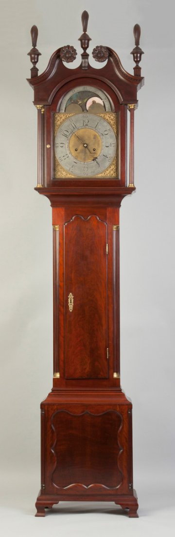 Pennsylvania Chippendale Tall Case: Pennsylvania Chippendale Tall Case. C. 1785. Mahogany with fluted quarter columns; swan's neck top, carved rosettes; some restorations. Brass moon phase dial with silvered chapter ring. 8 day time & s