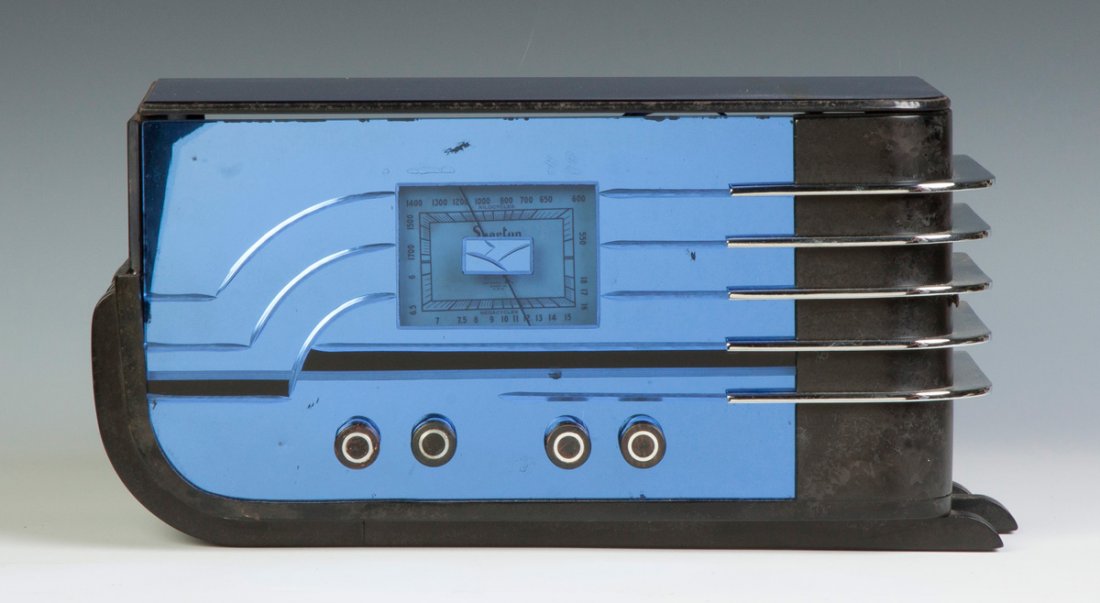 Sparton Glass & Plasticor Bakelite Sled Mirror Radio,: Sparton Glass & Plasticor Bakelite Sled Mirror Radio, Model 558C. Walter Teague design. Blue toned glass. Ht. 9" W 17" D 8 1/2".