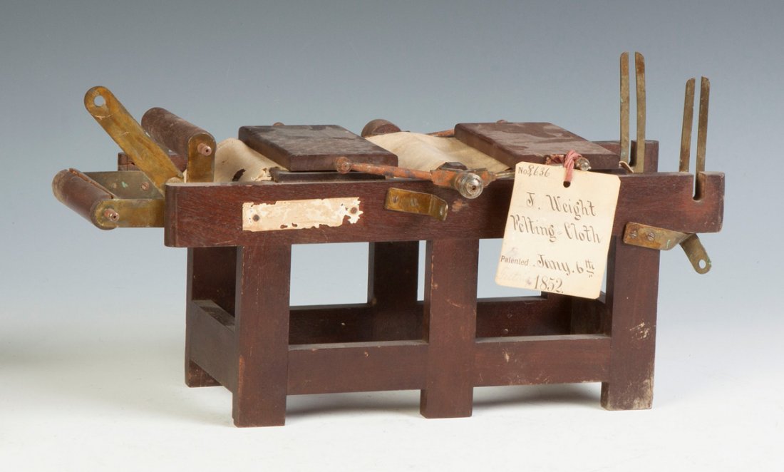 Joseph Weight Felting Machine: Joseph Weight Felting Machine. C. 1852. Lawrence, MA. Walnut & iron. Ht. 8 1/2" L 16" W 5" . Property of the Strong, sold to benefit the museum's collections fund.