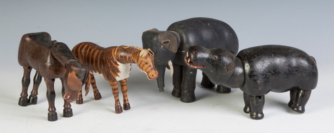 Four Schoenhut Figures: Four Schoenhut Figures. 1. Mule, glass eyes. 2. Zebra, glass eyes, original paint. 3. Hippo, glass eyes, some wear, missing one eye. 4. Elephant, glass eyes. Max. Ht. 6".