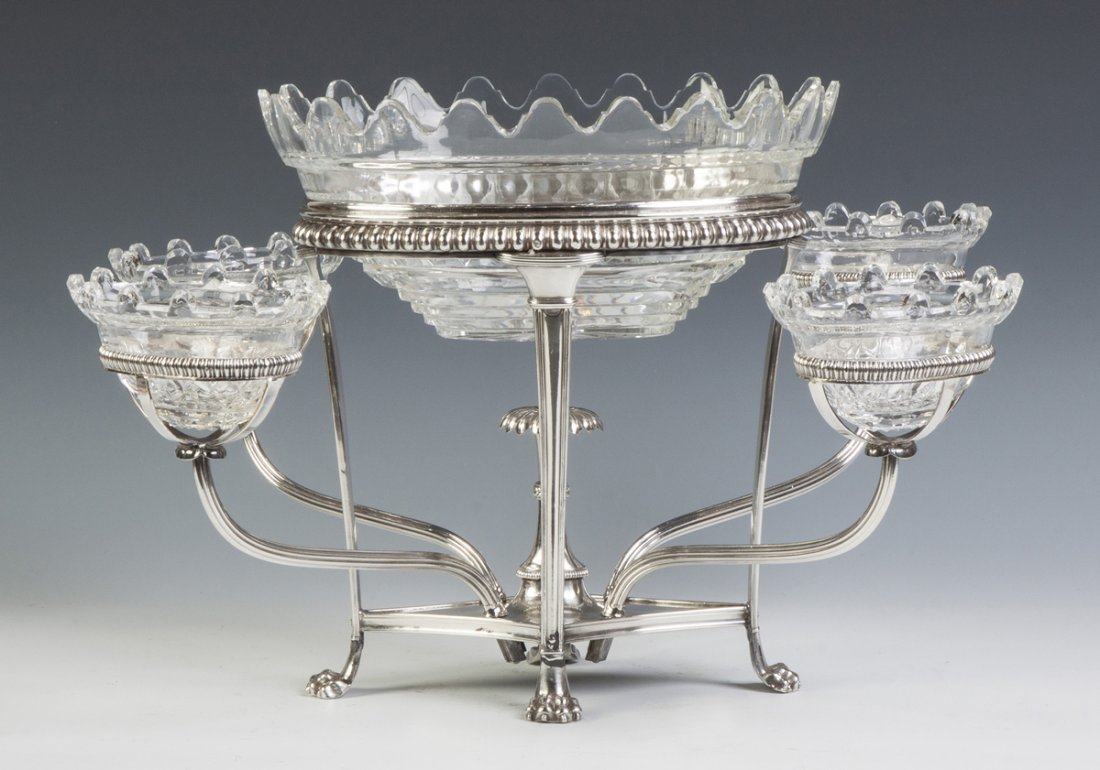 Silver Plate Epurn with Cut Glass Inserts: Silver Plate Epurn with Cut Glass Inserts. 19th cent. Paw feet, gadrooned borders. Ht. 12" W 21" D 18". Richard Bright and Kyle Goodman Collection, Corning, NY.