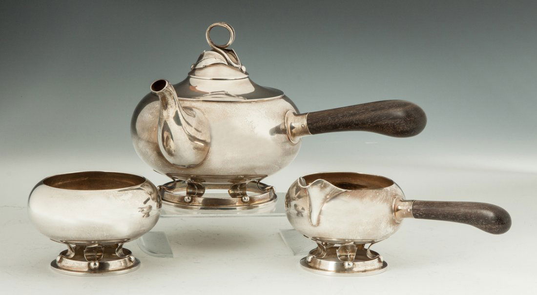 Allan Adler Sterling Silver Three Piece Tea Set: Allan Adler Sterling Silver Three Piece Tea Set. C. 1920's. Ebony handles. 44 ozt. Ht. 6" W 10".