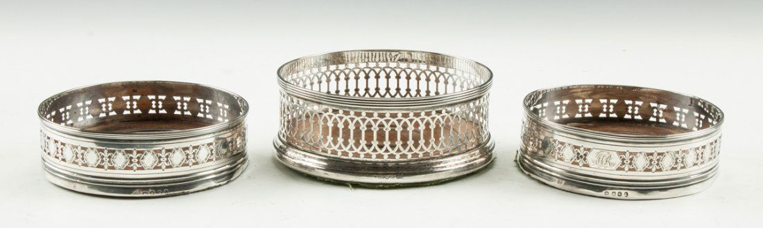 Three George III Sterling Silver & Mahogany Wine: Three George III Sterling Silver & Mahogany Wine Coasters. 2 smaller ones are monogrammed. Max. Ht. 2" Dia. 5". Ex. Collection of Walter Vogel, Rochester, NY.