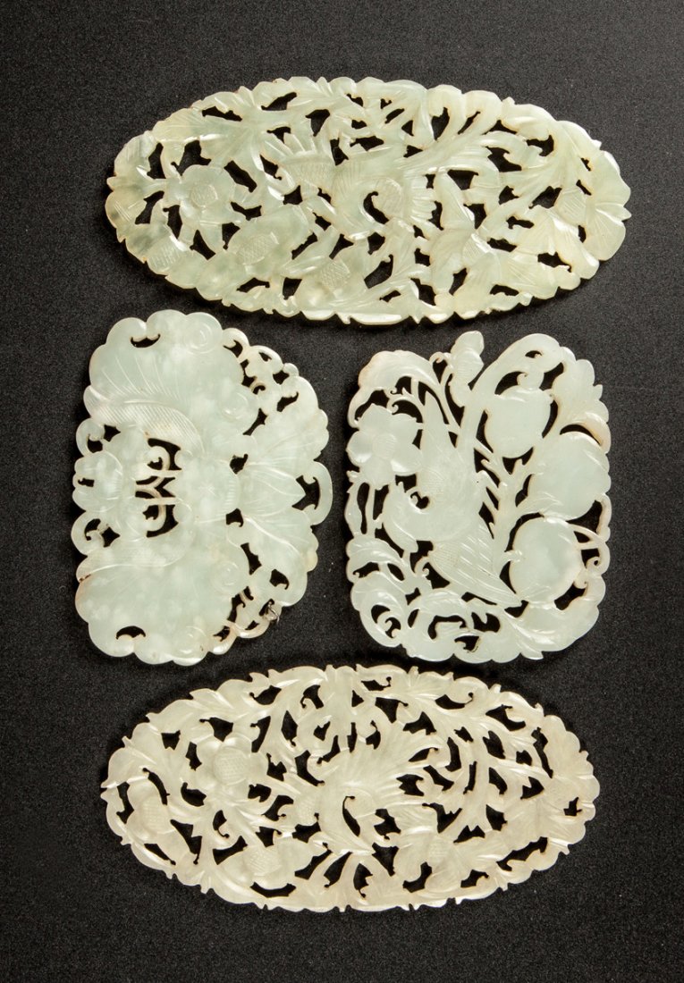 Four Chinese Jade Pierce Carved Plaques: Four Chinese Jade Pierce Carved Plaques. With butterflies, birds & flowers. Max. Ht. 2 1/4" L 4 1/2". A Syracuse, NY Collection.