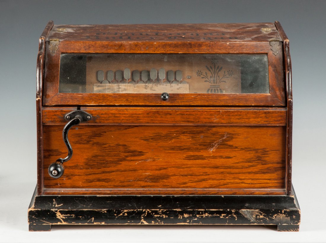 Chautauqua Roller Organ: Chautauqua Roller Organ. Oak. Several extra cobs. Ht. 13" W 17" The Dr. Richard & Jill Pope Collection.