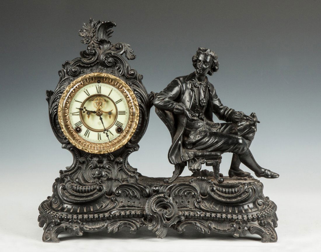 Ansonia Figural Shelf Clock: Ansonia Figural Shelf Clock. 19th cent. Metal case, painted black. Porcelain dial. Outside escapement. 8 day time & strike movement. Ht. 14 1/2" The Dr. Richard & Jill Pope Collection.