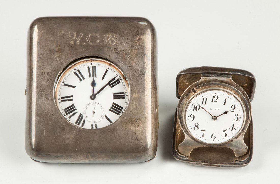 Two Sterling Silver Traveling Watches: Two Sterling Silver Traveling Watches. Unmarked watch; case has hallmark WC. Majestic Watch Co., 15 jewel, missing bezel. Case 4" x 4 1/2"; Max. Dia. 2 5/8" Ex. Collection of Walter Vogel, Rochester,