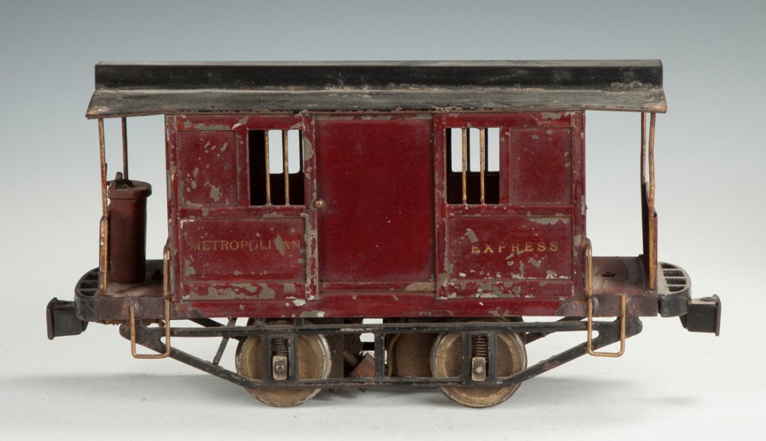 Early Lionel Metropolitan Express "Jail Car": Early Lionel Metropolitan Express "Jail Car". C. 1904-1905. Painted tin & cast iron. Electric. 2 7/8 gauge #800. Ht. 7 1/2" L 15" The Dr. Richard & Jill Pope Collection.