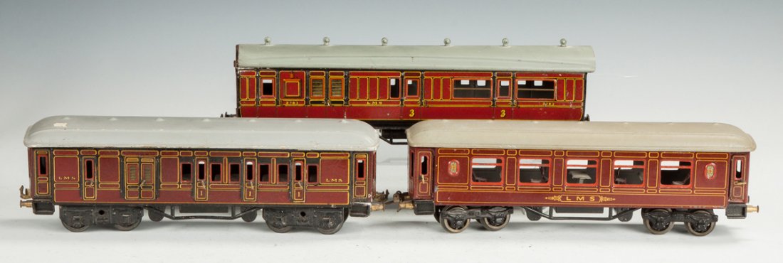 Two Bing Train Cars & One Unmarked German Car: Two Bing Train Cars & One Unmarked German Car. Ht. 4" L 12" The Dr. Richard & Jill Pope Collection.