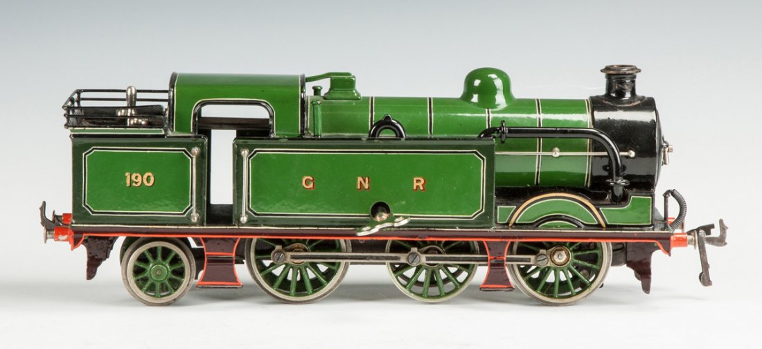 Bing for Bassett-Lowke Clockwork Tank Engine 190, GNR: Bing for Bassett-Lowke Clockwork Tank Engine 190, GNR. Painted tin. Ht. 5" L 14" The Dr. Richard & Jill Pope Collection.