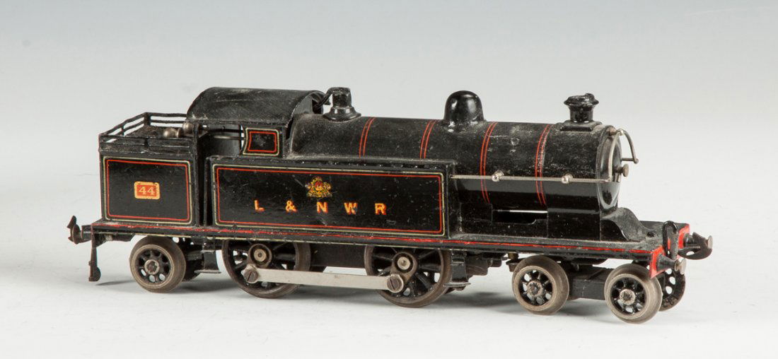 Marklin Clockwork Engine, L & NWR #44: Marklin Clockwork Engine, L & NWR #44. Electric. Ht. 4" L 12" The Dr. Richard & Jill Pope Collection.