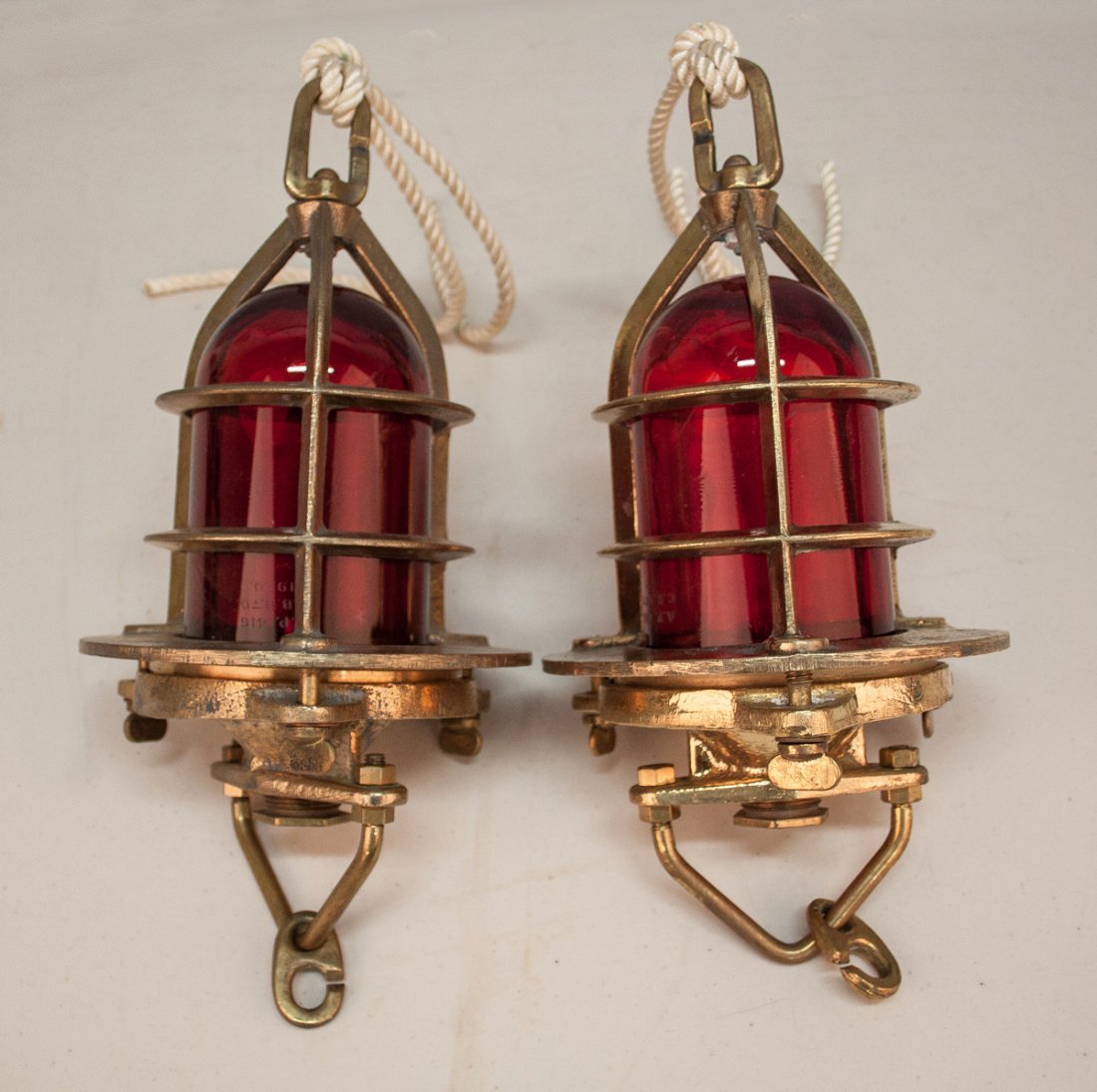 Two Vintage British Convoy Brass Ship's Lights with Red: Two Vintage British Convoy Brass Ship's Lights with Red Globes. C. 1950's. Globe: AP 416A. Frame: C.B. Ltd. AP7009 B MOD. Ht. 15" W 7".