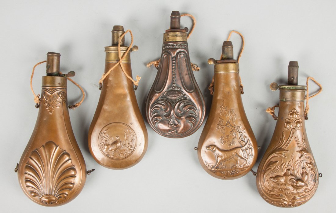 Group of Brass Embossed Powder Flasks: Group of Brass Embossed Powder Flasks 19th century. One marked P. Powell & Son, Cincinnati. Max. Ht. 9"