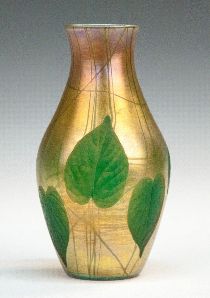 Tiffany Leaf and Vine Vase with Intaglio Leaves: Tiffany Leaf and Vine Vase with Intaglio Leaves. Early 20th century. Sgn. Louis C. Tiffany Furnaces Inc. Favrile 6299N. Ht. 9" Max. Dia. 5". A Buffalo, NY Estate.