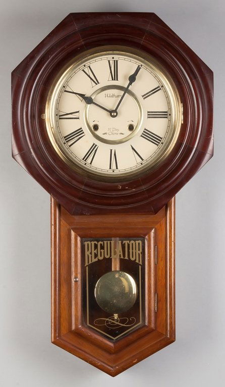 Waltham, Korea 31 Day Chime Regulator: Waltham, Korea 31 Day Chime Regulator. Mahogany case. Painted metal dial. 8 day time and strike spring driven brass movement. Ht. 29".