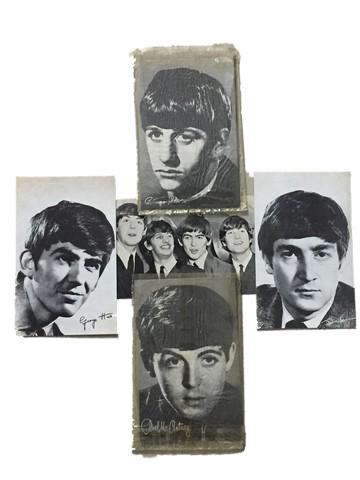 The Beatles Rare Exhibition Photocards: John Lennon, Paul McCartney, George Harrison and Ringo Starr are The Beatles ca. 1964.These are rare and original black and white exhibition photocards (13) (approx. 3.5 x 5 in.) . Verso is blank with
