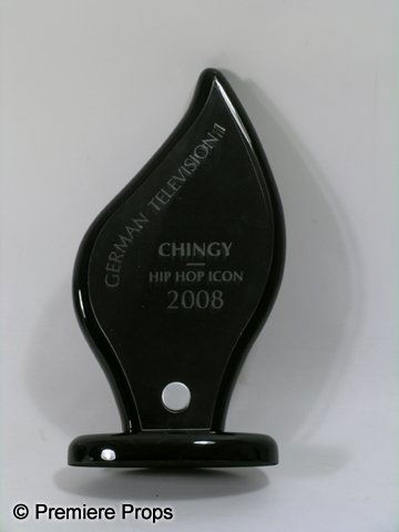 Bruno German Television Award Trophy Movie Props: Bruno - From the set, this is a black & clear flame-shaped 'German Television 1 Chingy Hip Hop Icon 2008' trophy. (approx 10 3/4" x 5 3/4" x 2 3/4") (BRU2043)