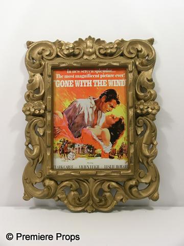 "Gone with the Wind" Framed Poster: "Gone with the Wind" featuring Clark Gable and Vivien Leigh framed movie poster in a fancy gold plastic frame. (approx. 27" x 20") Item is oversized and will require additional shipping charges. Pleas