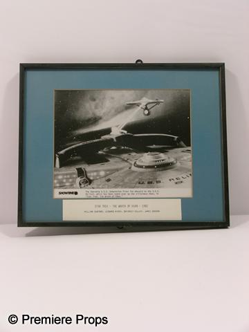 Star Trek Framed Photo: Star Trek - The Wrath of Khan (1982) framed in a metal frame movie photo featuring The Starship U.S.S Enterprise, and a title card at the bottom. (approx. 11 1/2" x 14 1/2")