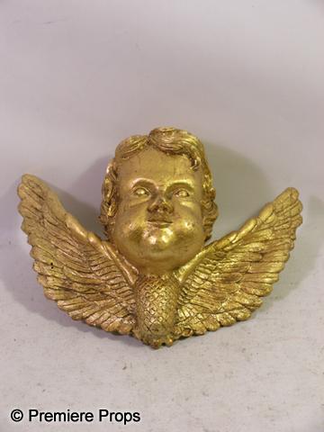 Angels and Demons Angel Head With Wings Movie Prop: Angels and Demons - From Angeles and Demons, this is a gold painted molded angel head from a large church set piece. This head has a screw in the back. (approx. 13 1/2" x 11") (EA2008)