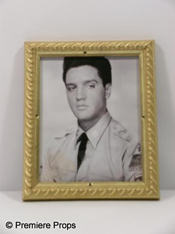 Elvis Presley Framed Photo: Elvis Presley dressed in a uniform, black and white photo framed in a gold frame. (approx. 10" x 12 1/2")