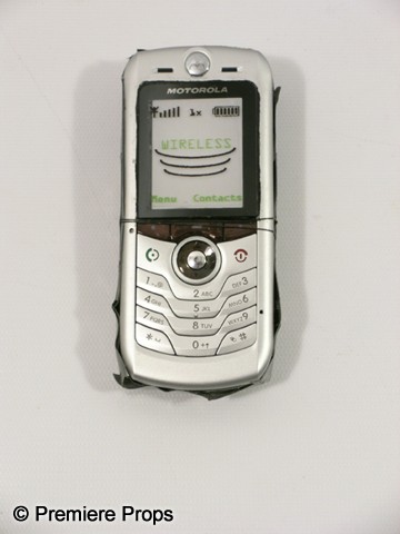 Devil Mechanic Tony (Logan Marshall-Green) Movie P: Devil - Mechanic Tony (Logan Marshall-Green) screen used, hero, silver plastic 'Motorola' cell phone with fake screen on the front and duct taped on the back.