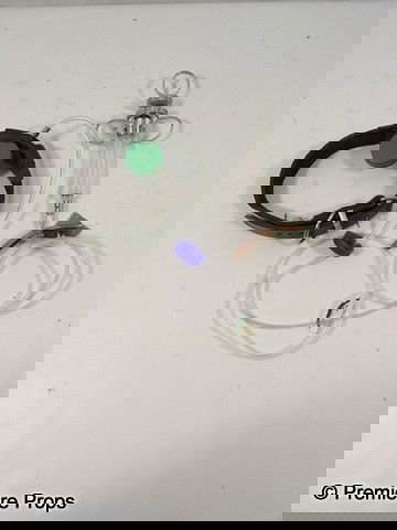 Red Frank (Bruce Willis) Syringe Rig Movie Props: Red - Frank (Bruce Willis) screen used, hero, metal and glass syringe with clear plastic tubing with a blue bottle cap attached to a leather belt rigged with tape for use with his arm.