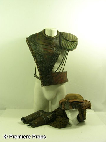 HIGHLANDER: THE QUICKENING - Christopher Lambert C: Highlander II: The Quickening (1991) - Connor MacLeod (Christopher Lambert) screen worn, custom made costume. Consists of brown leather with intricate design, padded shoulder, belt around the waist, v