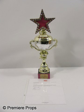 HIGH SCHOOL MUSICAL - Star Dazzle Award Prop: High School Musical (2006) - Star Dazzle Award. Seen throughout the series, this is trophy is won by the group at the end of the second film. Won in a contest, it comes with a letter from TV Guide. Th