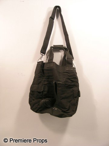 Scream 4 Gale Weathers-Riley (Courteney Cox) Bag M: Scream 4 - Gale Weathers-Riley (Courteney Cox) screen used, dark grey cloth with a small hole at the bottom bag with strap. (approx. 16" x 16")