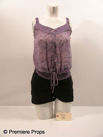 Scream 4 Trudie (Shenae Grimes) Movie Costumes: Scream 4 - Trudie (Shenae Grimes) screen worn, purple see through with floral print, button up the front blouse, nude 'Gap' camisole, (size S) and black with zipper at the sides, 'American Apparel' sh