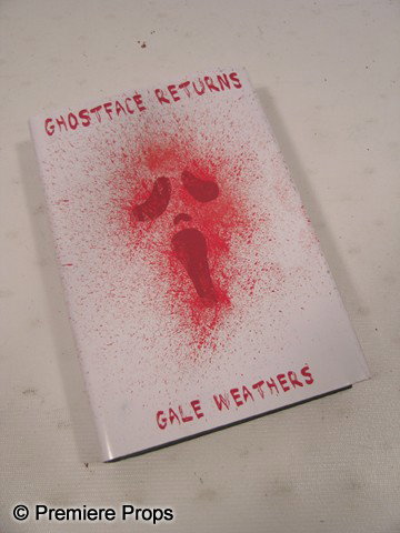 Ghoseface Returns Book Movie Props: Scream 4 - 'Ghoseface Returns' hardcover book cover by Gale Weathers (Courteney Cox), on top of a 'Terrorist Next Door' book. Condition may vary.