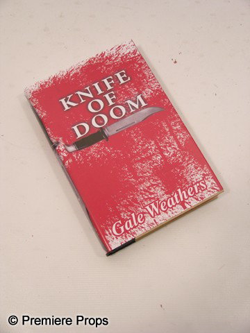 Scream 4 Gale Weathers-Riley (Courteney Cox) Movie: Scream 4 - Gale Weathers-Riley (Courteney Cox) screen used, 'Knife of Doom' Sidney Prescott' book cover over a 'Preacher's of Hate' book. (approx. 9 1/2" x 6 1/2")